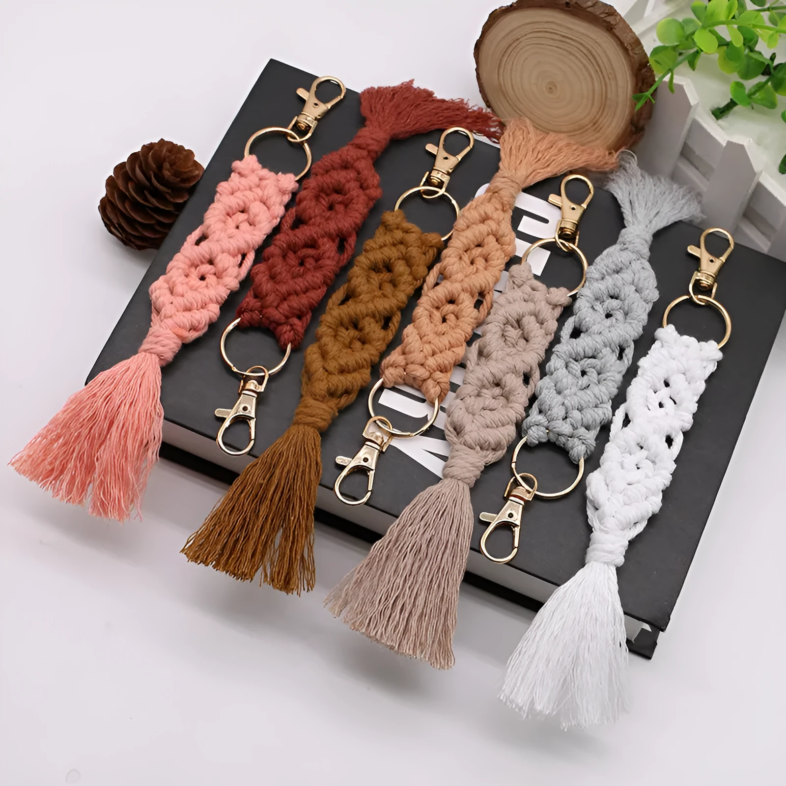 Hand-woven cotton tassel key chain in eight colours including brick red and rose pink for car keys and bag ornaments