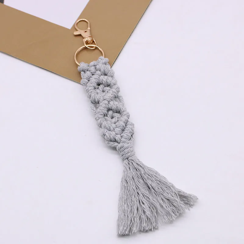 Hand-woven cotton tassel key chain in eight colours including brick red and rose pink for car keys and bag ornaments