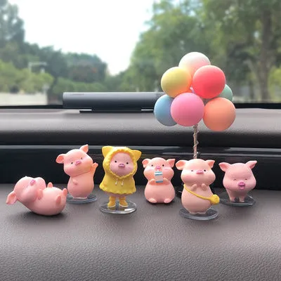 Six little pink resin pigs with colourful balloons on a rectangular anti-skid pad, cartoon car decoration