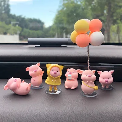 Six little pink resin pigs with colourful balloons on a rectangular anti-skid pad, cartoon car decoration