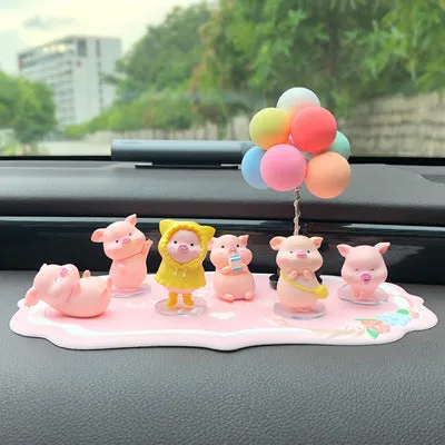 Six little pink resin pigs with colourful balloons on a rectangular anti-skid pad, cartoon car decoration