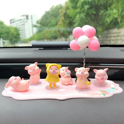 Six little pink resin pigs with colourful balloons on a rectangular anti-skid pad, cartoon car decoration