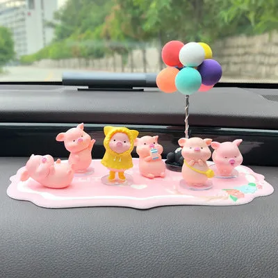 Six little pink resin pigs with colourful balloons on a rectangular anti-skid pad, cartoon car decoration