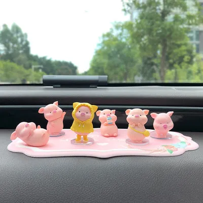 Six little pink resin pigs with colourful balloons on a rectangular anti-skid pad, cartoon car decoration