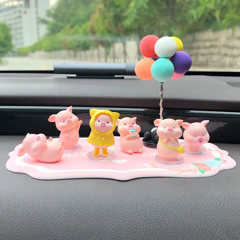 Six little pink resin pigs with colourful balloons on a rectangular anti-skid pad, cartoon car decoration