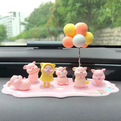Six little pink resin pigs with colourful balloons on a rectangular anti-skid pad, cartoon car decoration