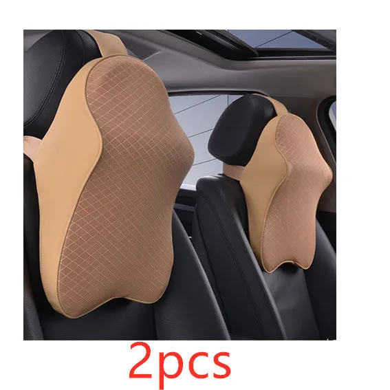 Memory foam car neck pillow with ergonomic shape, adjustable strap, and polyester cover on a car seat