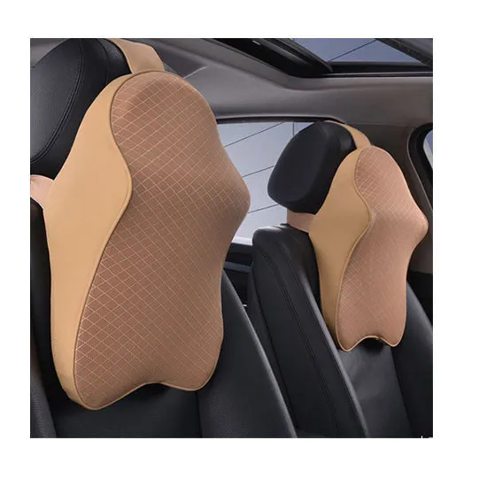 Memory foam car neck pillow with ergonomic shape, adjustable strap, and polyester cover on a car seat