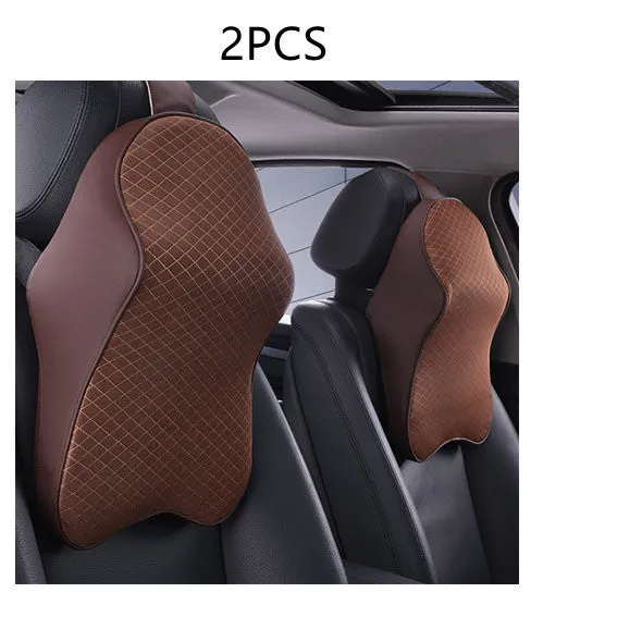 Memory foam car neck pillow with ergonomic shape, adjustable strap, and polyester cover on a car seat