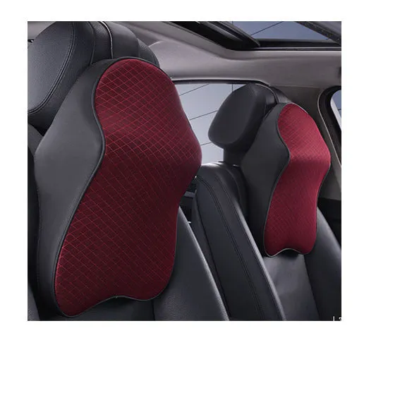 Memory foam car neck pillow with ergonomic shape, adjustable strap, and polyester cover on a car seat