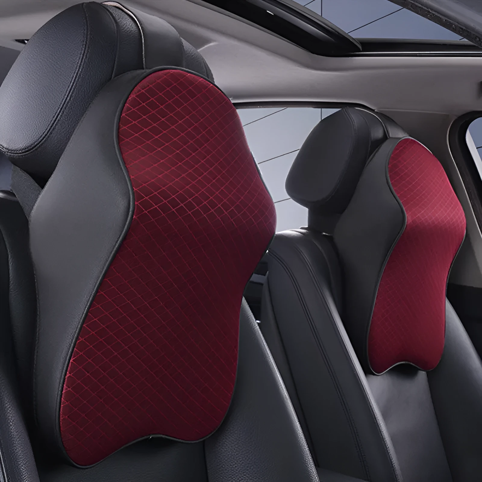 Memory foam car neck pillow with ergonomic shape, adjustable strap, and polyester cover on a car seat