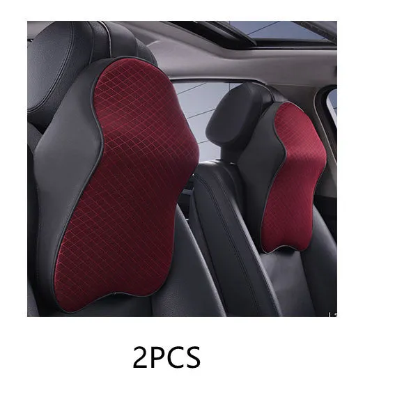 Memory foam car neck pillow with ergonomic shape, adjustable strap, and polyester cover on a car seat