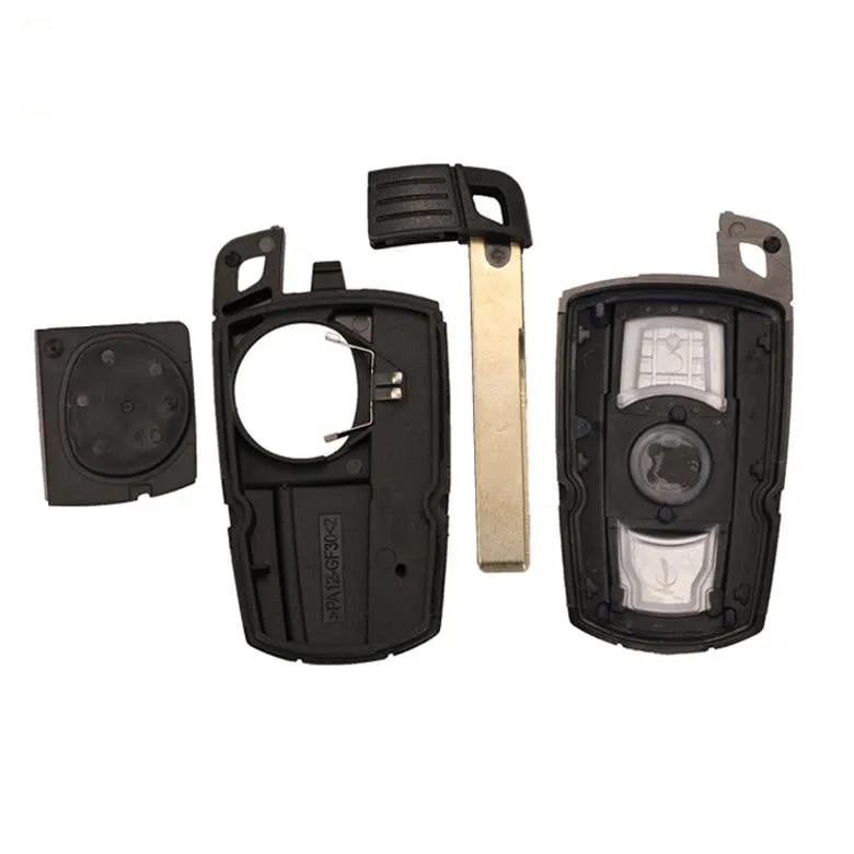 BMW semi-intelligent three-button remote car key fob on a grey background