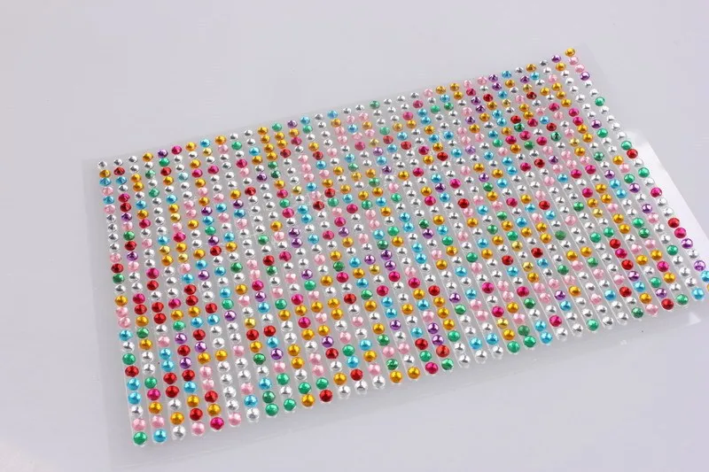 Acrylic rhinestone car drill sticker 22.5x10cm in silver on a car body panel with sparkling finish