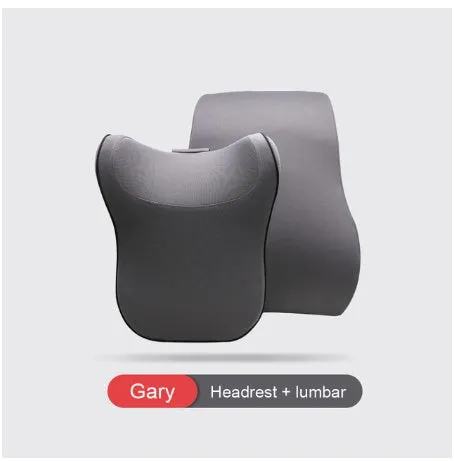 Car headrest and lumbar support cushion set in gray on a car seat
