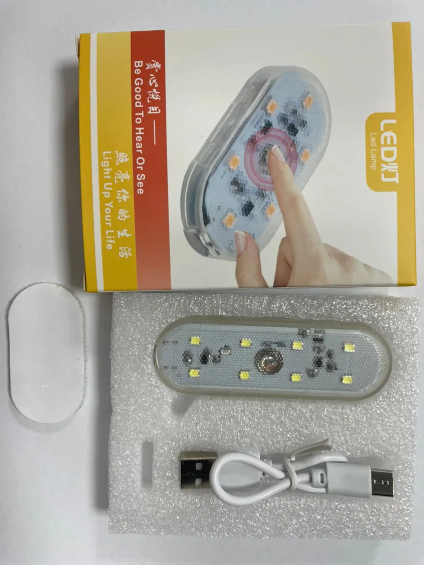 Touch-sensitive USB rechargeable car atmosphere lamp showing ice blue LED light with Velcro mount