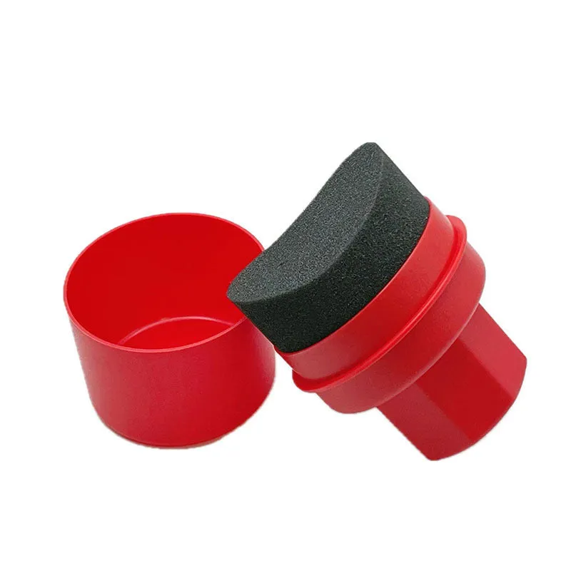 Black and red car tyre polishing sponge brushes with lids on a white background.