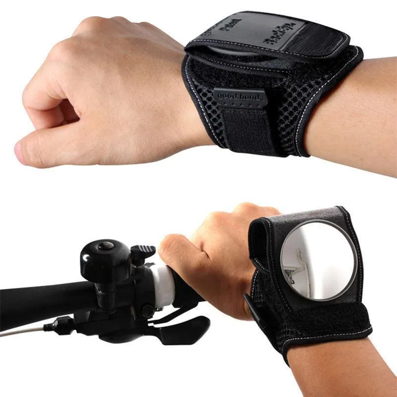 Bicycle wrist safety mirror with adjustable strap and anti-slip pad on a cyclist's wrist