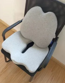 Cotton memory foam seat cushion in light gray on a wooden chair, measuring 46x32cm