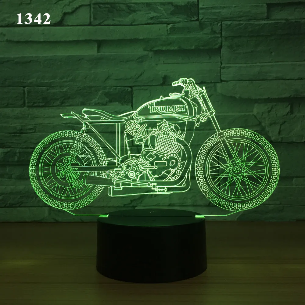 Motorcycle LED desk lamp with black base and acrylic shade on a wooden desk, 220x130x90mm
