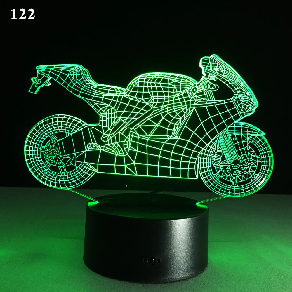 Motorcycle LED desk lamp with black base and acrylic shade on a wooden desk, 220x130x90mm