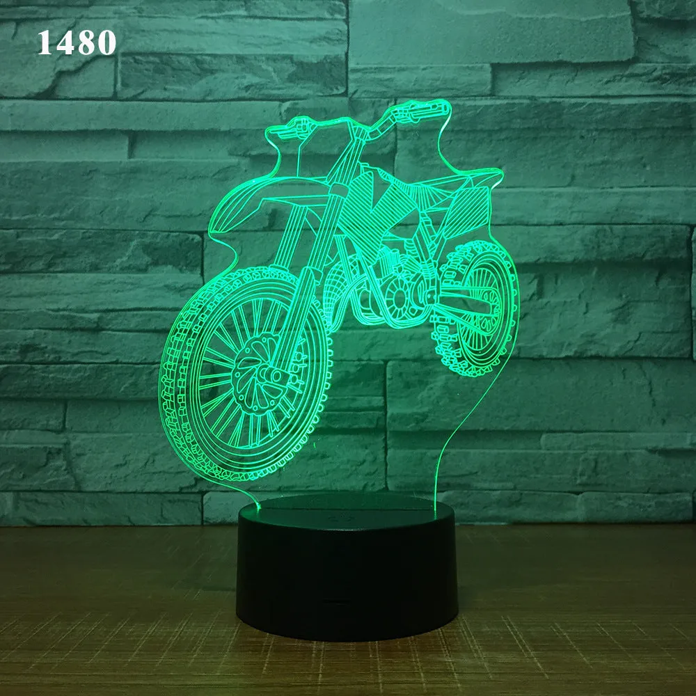 Motorcycle LED desk lamp with black base and acrylic shade on a wooden desk, 220x130x90mm