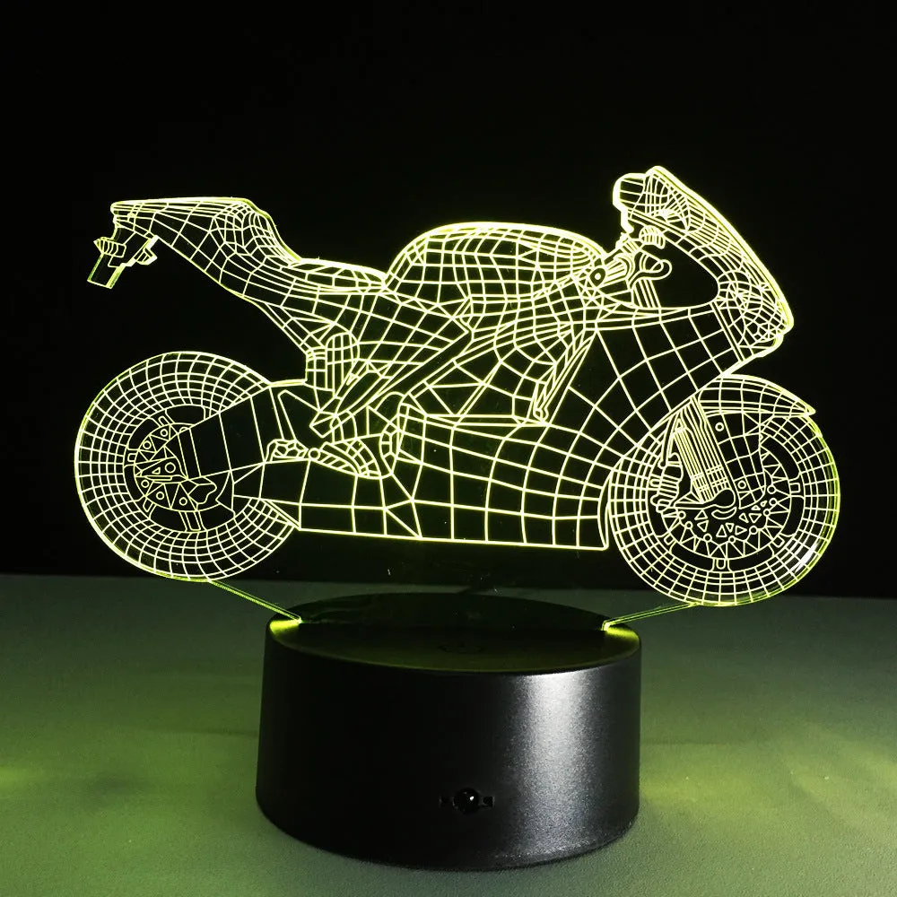 Motorcycle LED desk lamp with black base and acrylic shade on a wooden desk, 220x130x90mm