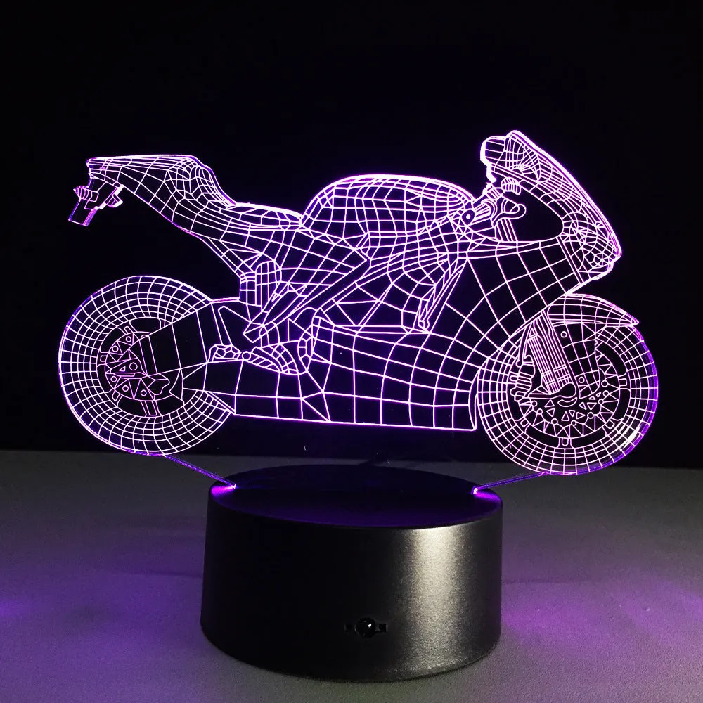 Motorcycle LED desk lamp with black base and acrylic shade on a wooden desk, 220x130x90mm