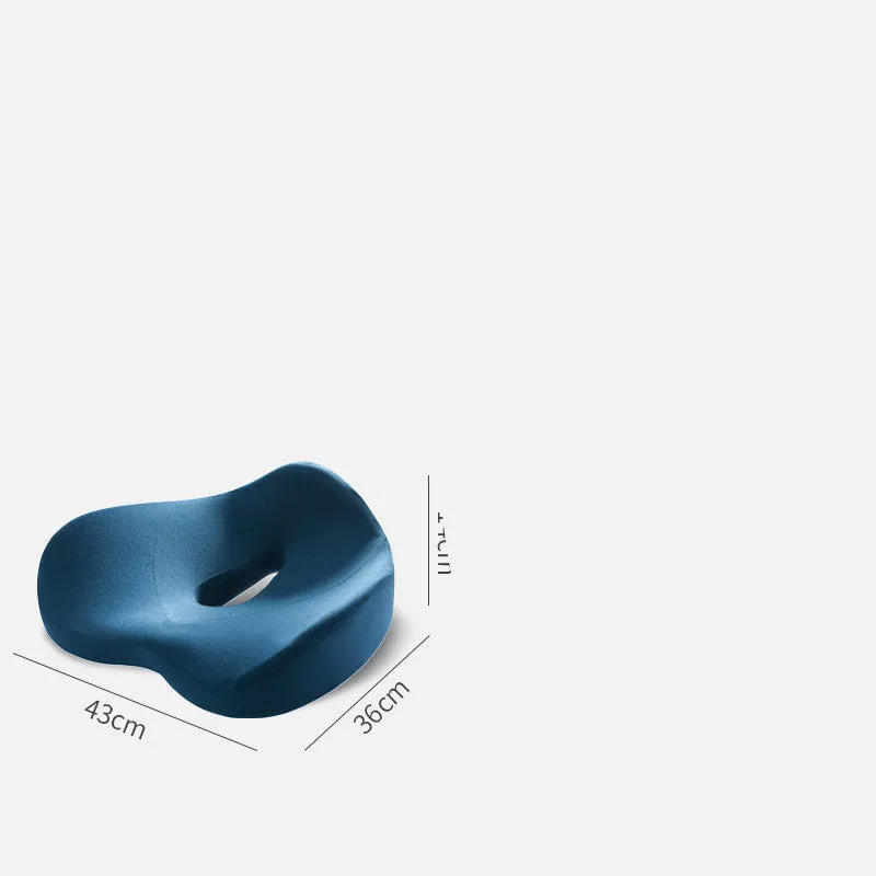 Memory foam seat cushion in light grey and navy blue on an office chair, 43x36x14cm