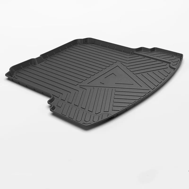 Black TPE car boot liner with carbon fibre pattern texture lying flat.