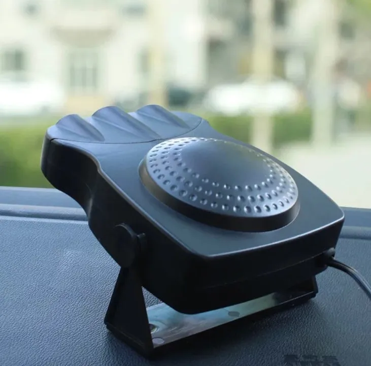 Portable car windshield defroster fan in black and red ABS housing on dashboard with power cable