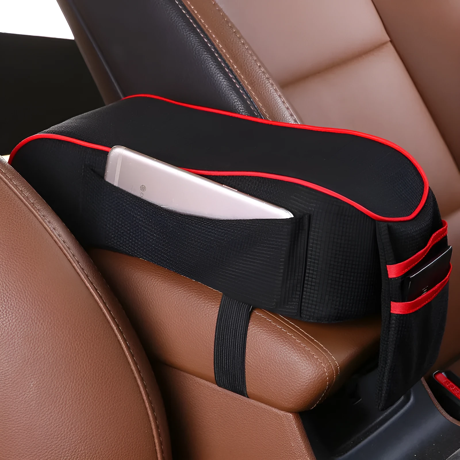 Sports knitted fabric car armrest box pad in Black Red colour on a car centre console. Measures 16x30cm.