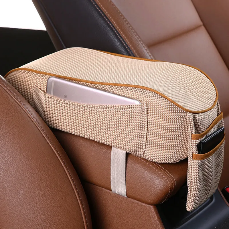Sports knitted fabric car armrest box pad in Black Red colour on a car centre console. Measures 16x30cm.