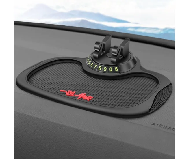 Non-slip car phone pad in black with red edge, showing 4-in-1 functions including phone holder and aromatherapy holes
