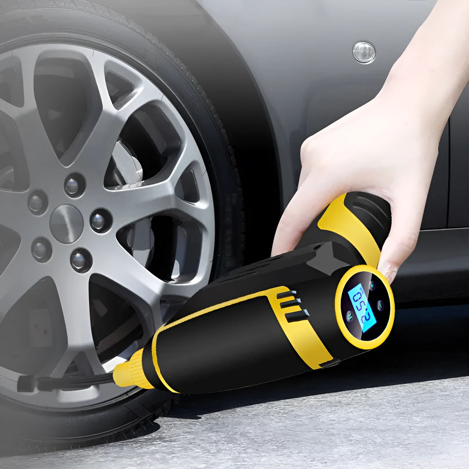 Black handheld digital LED car air compressor with 120W power and auto stop on a dark background