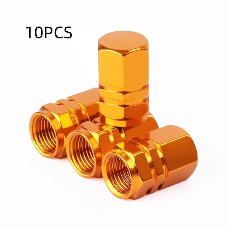 Set of ten aluminium alloy car valve caps in blue, red, silver, gold and black on a white background
