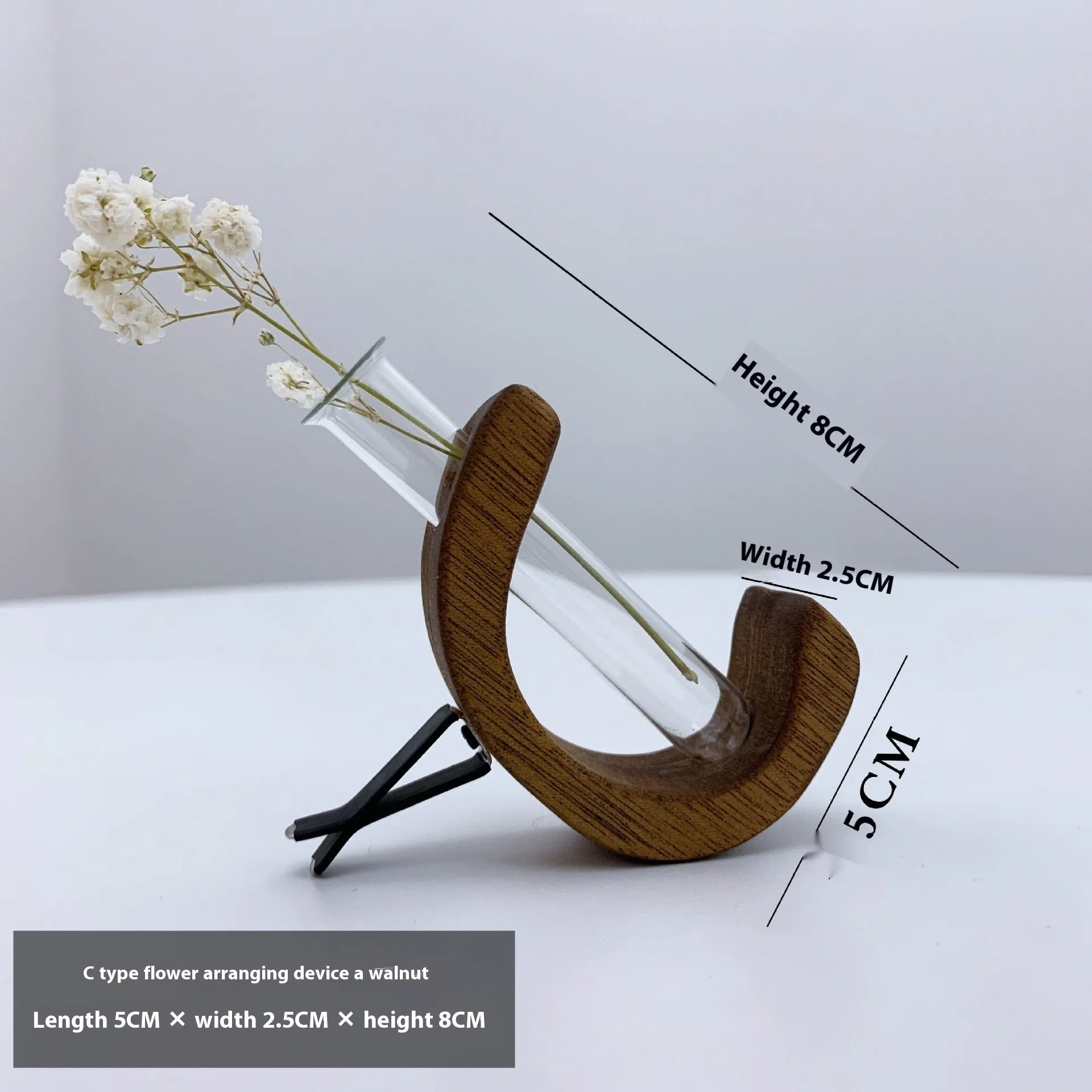 Wooden C-shaped car flower container in Beech finish on a car air vent