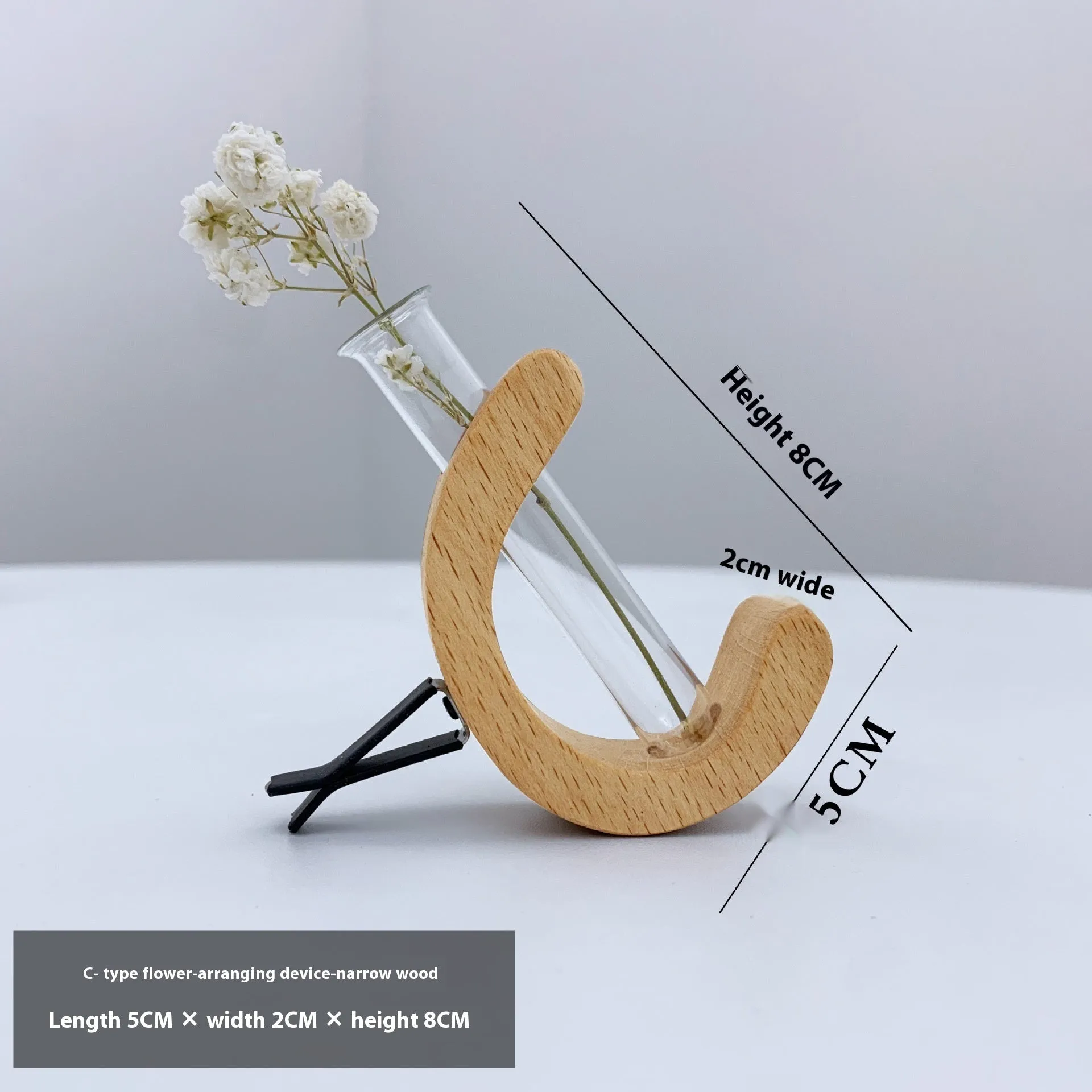 Wooden C-shaped car flower container in Beech finish on a car air vent