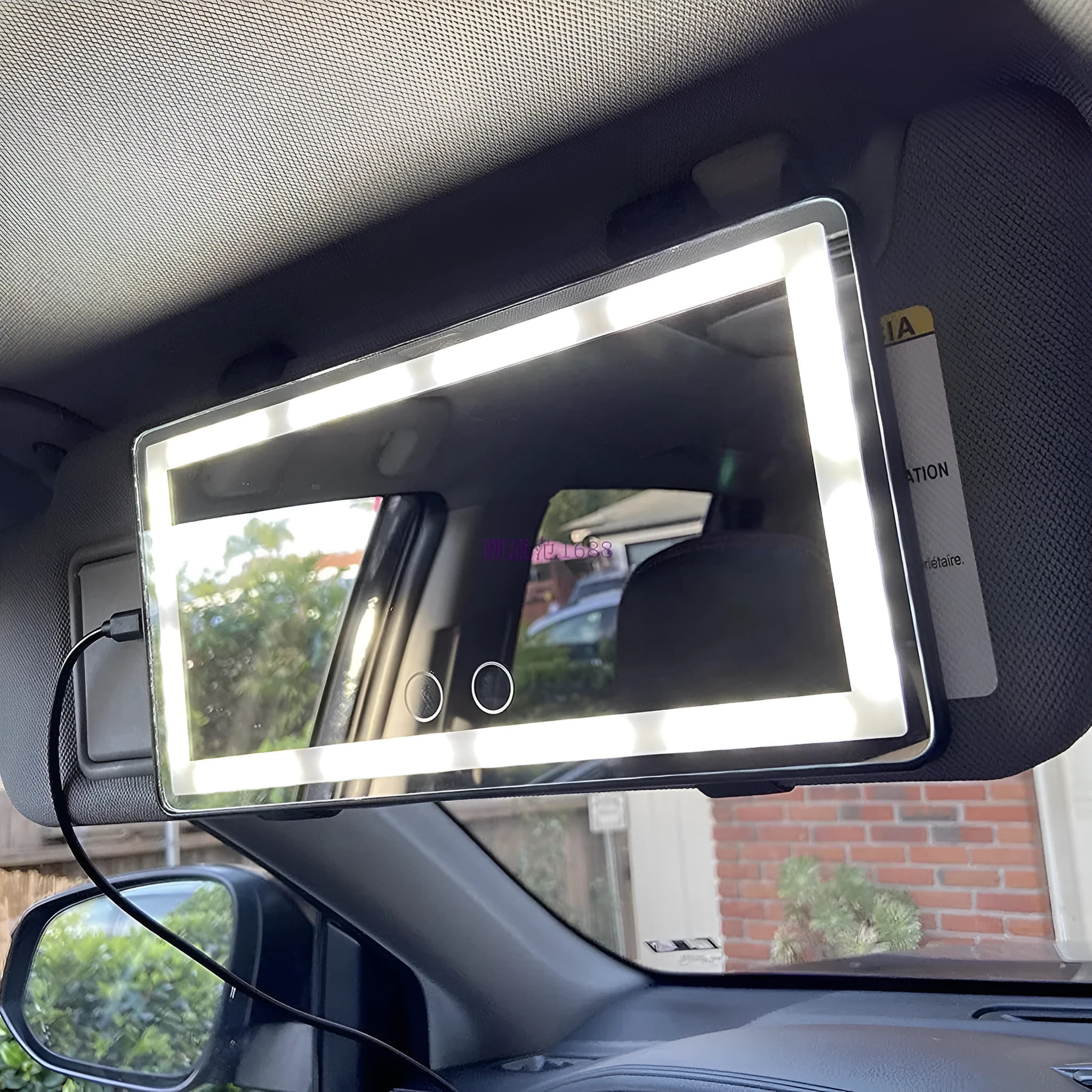 Car sun louver mirror with LED touch lamp clipped to sun visor, showing aluminium mirror and black light bars on four sides