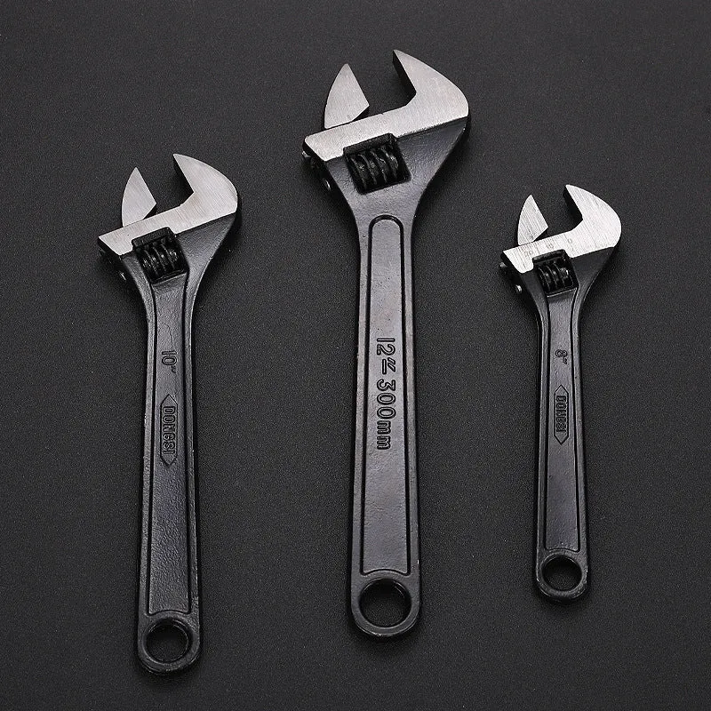 10-inch black high carbon steel adjustable open-end wrench on a workbench