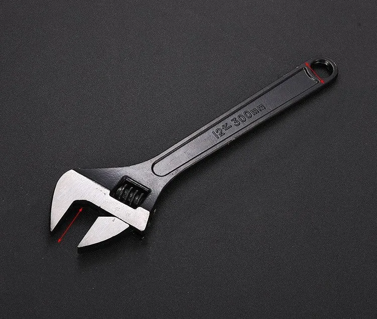 10-inch black high carbon steel adjustable open-end wrench on a workbench