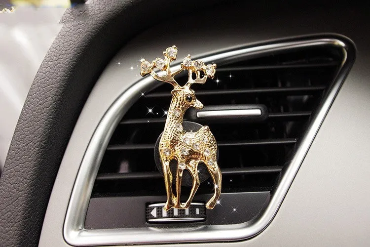 Alloy car fragrance clip with decorative charm attached to car air vent