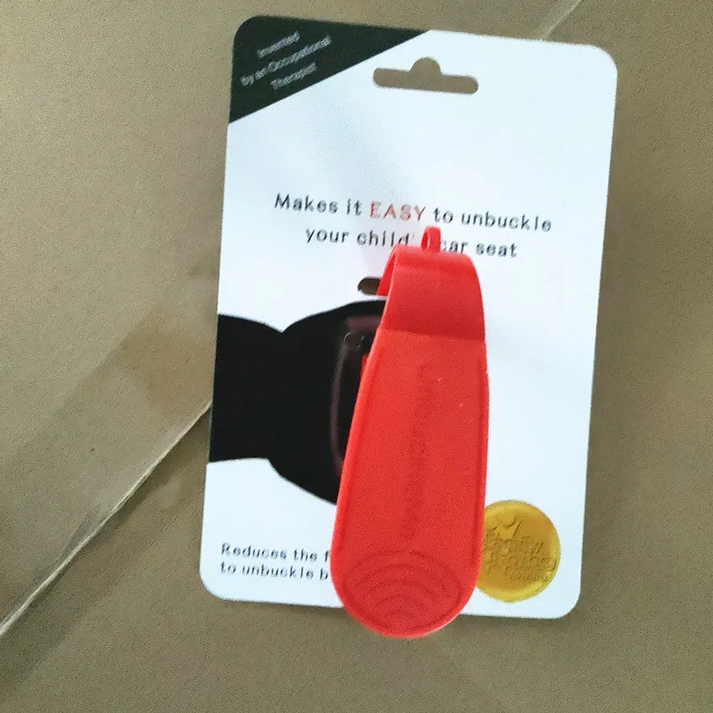 Red ABS coated car seat buckle unlocker measuring 4 x 9 cm on a keyring