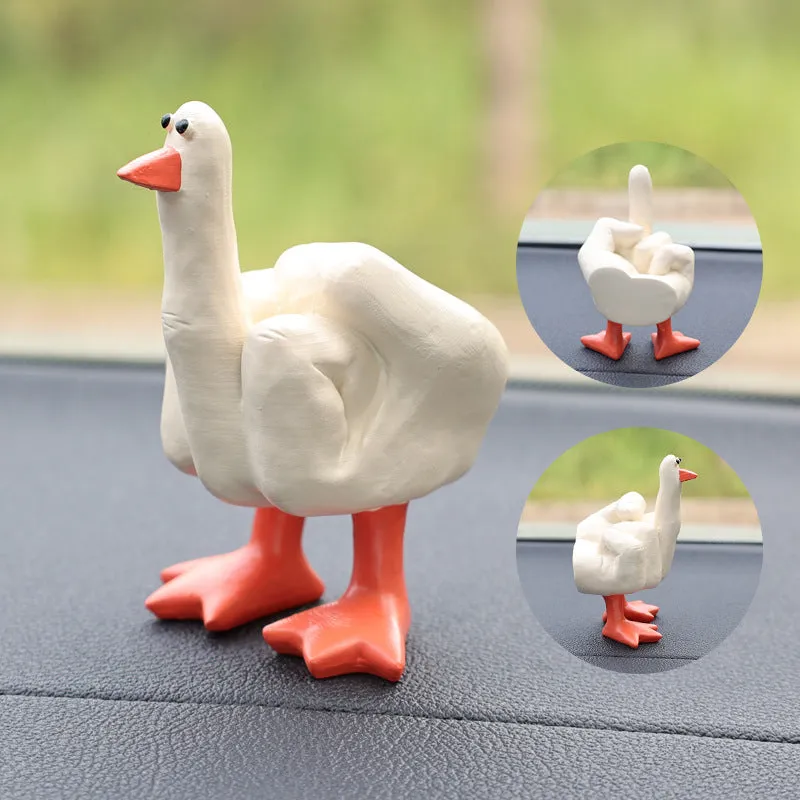 Creative middle finger duck cartoon resin ornament in beige, 50x77mm, on car centre console