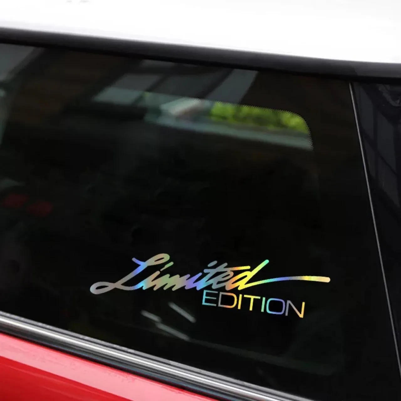 Black reflective laser-cut car sticker on vehicle window
