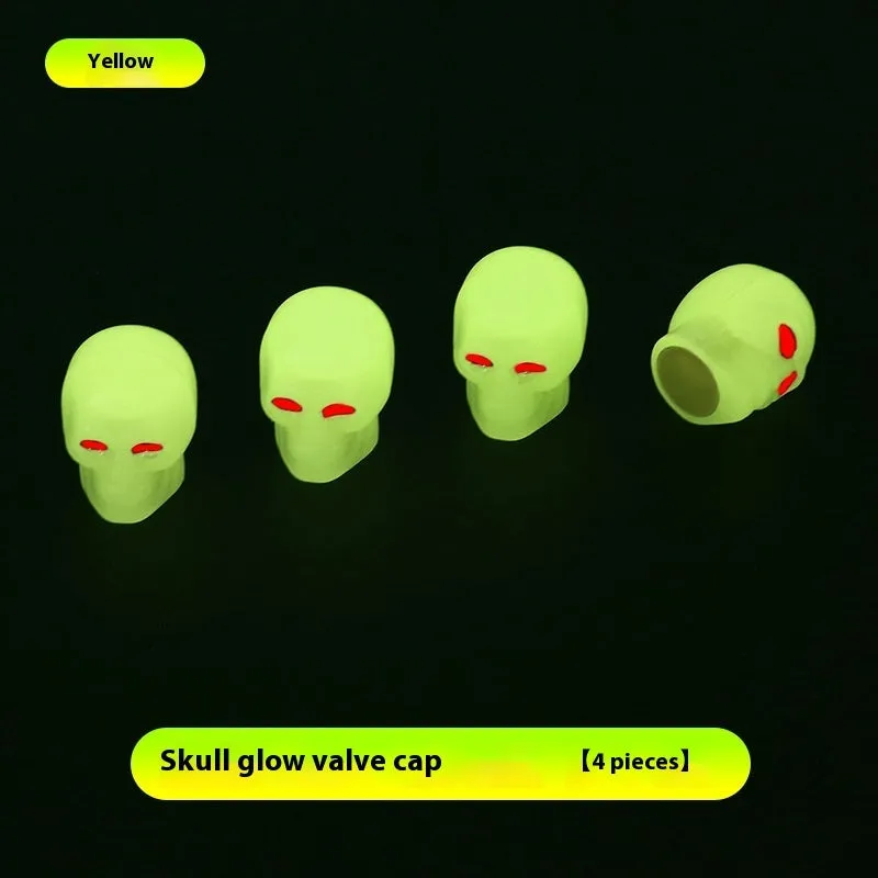 Luminous skull-shaped rubber car tyre valve cap in glow effect on a standard wheel