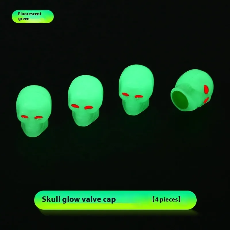 Luminous skull-shaped rubber car tyre valve cap in glow effect on a standard wheel