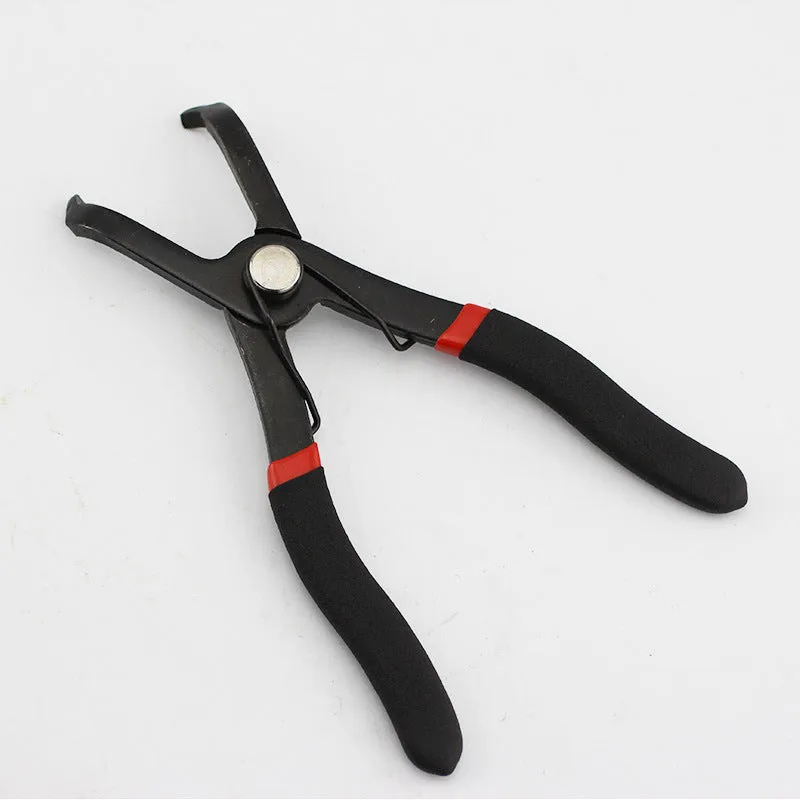 Red round nail removal pliers with PVC handles and adjustable jaws for interior trim work