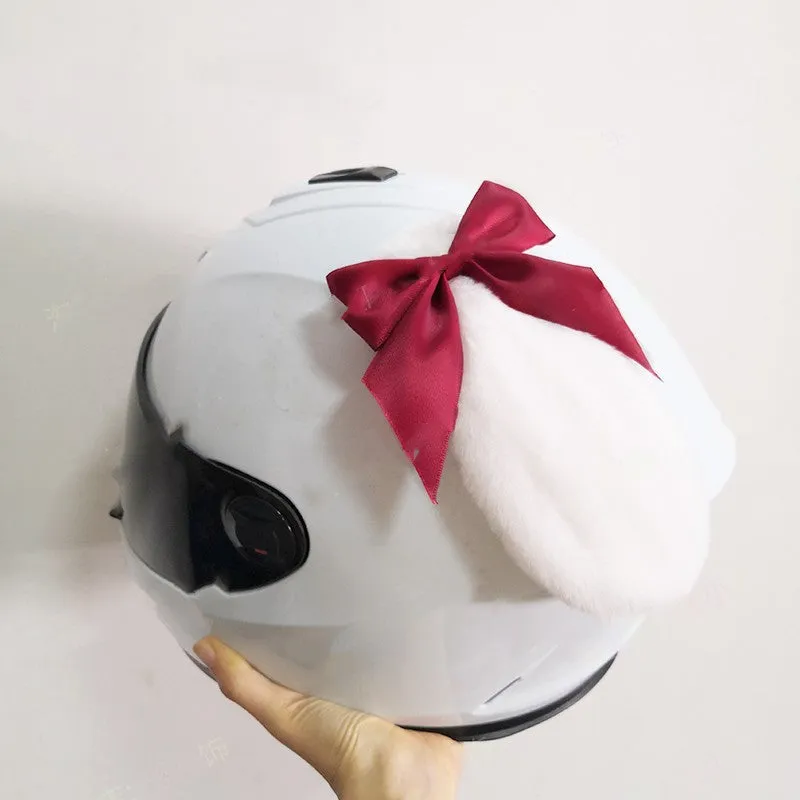 Carbon fibre rabbit ears motorcycle helmet decoration in various colours on a black helmet.
