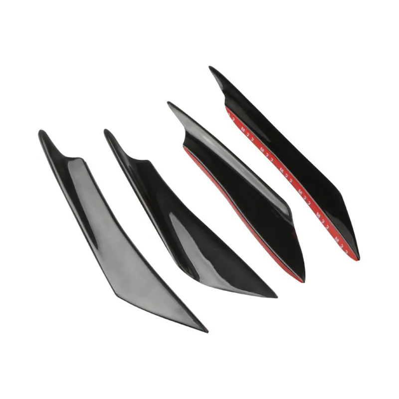 Set of four ABS plastic bumper air knife spoilers in a carbon fibre finish for car modification.
